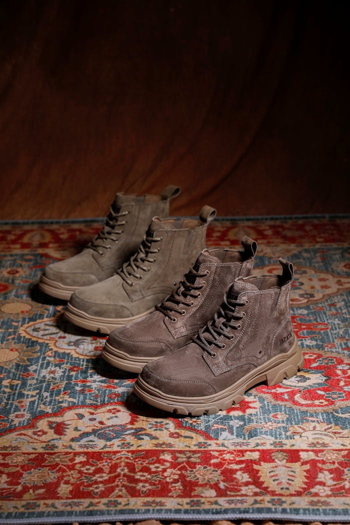 The Art of Drawing Readers In: Your attractive post title goes here Fashionable brown suede boots on a colorful vintage patterned rug.